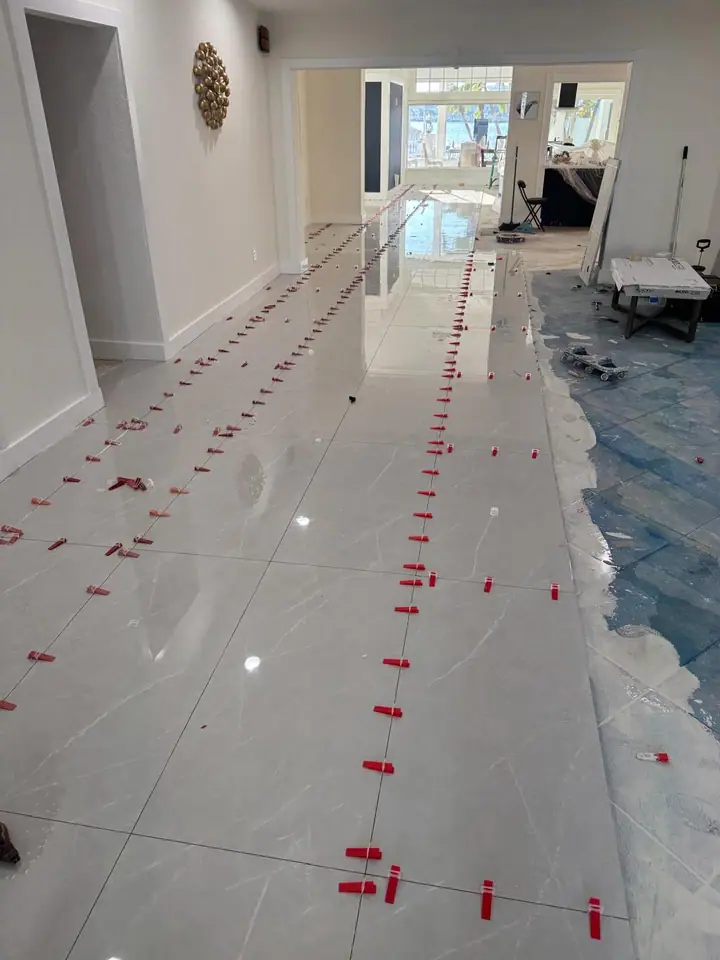 High-gloss large-format marble-look porcelain floors in a living space