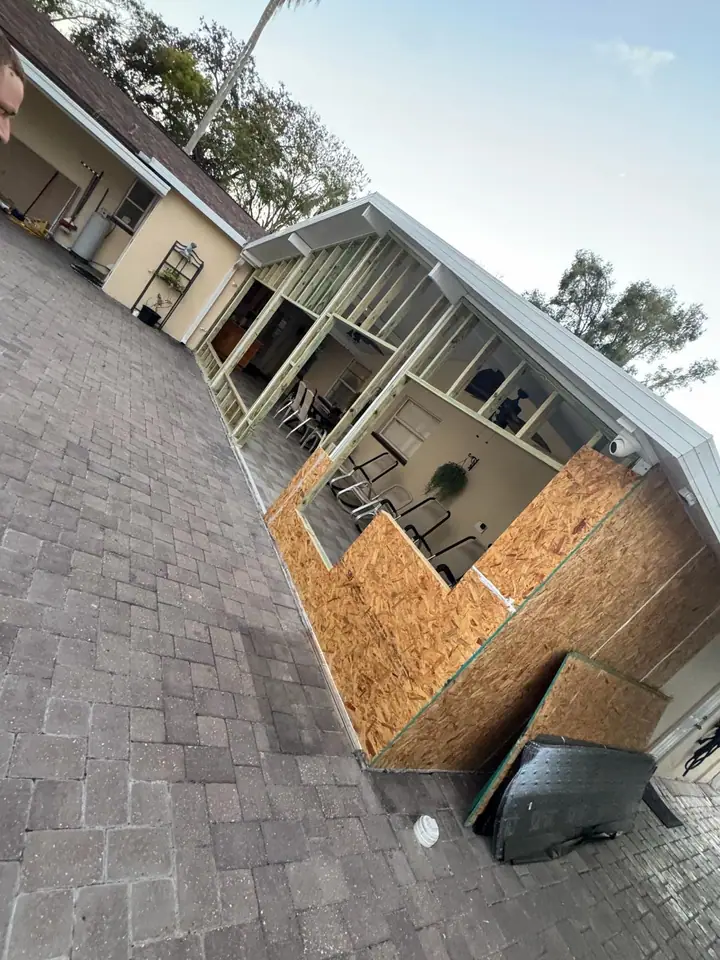 Residential patio being framed and enclosed with new windows and doors