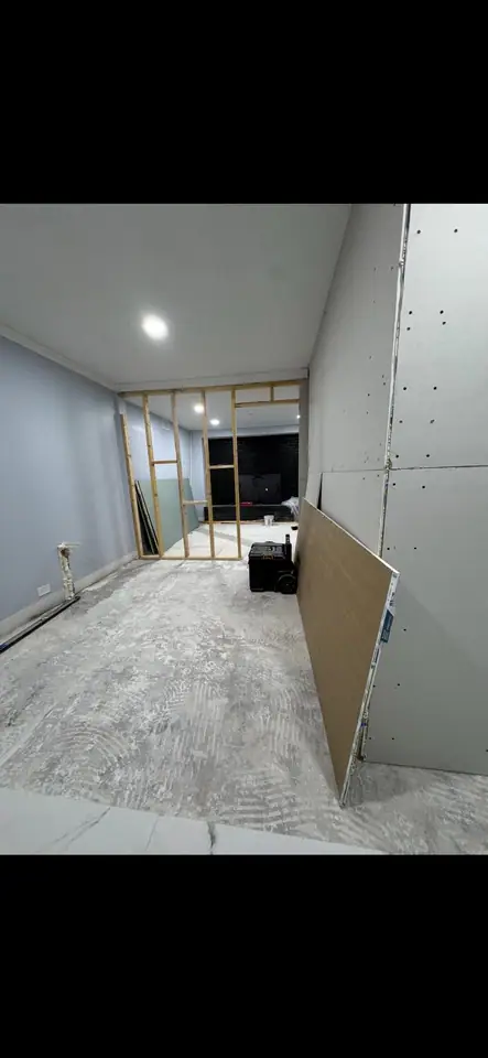 Interior remodel with new wood framing and drywall sheets hung