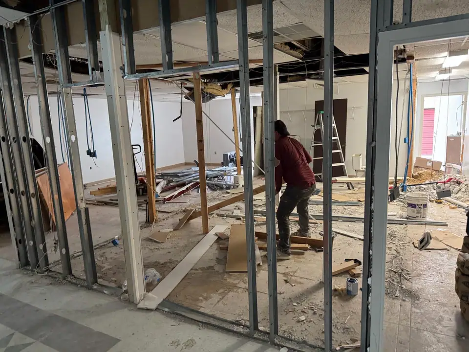 Commercial interior with large-format tile and a decorative floor inlay