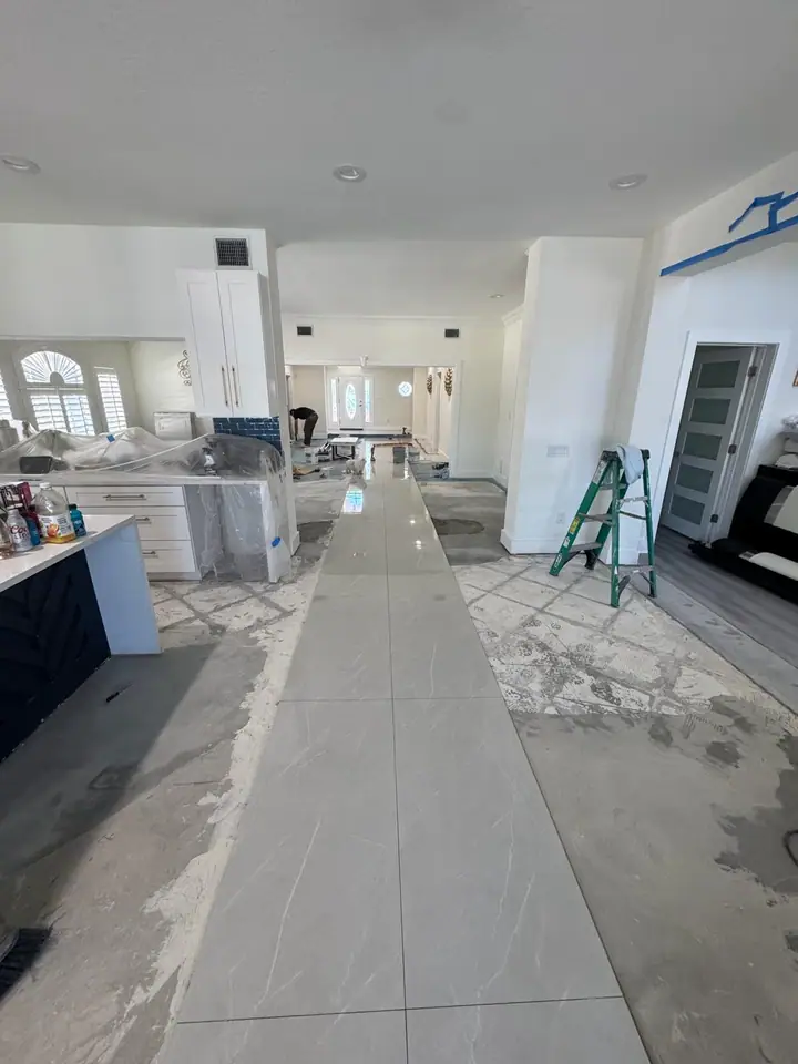 High-gloss large-format marble-look porcelain floors in a living space