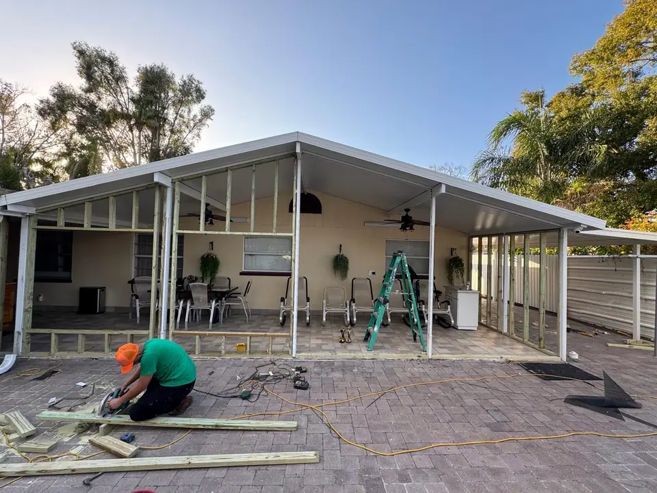 Residential patio being framed and enclosed with new windows and doors