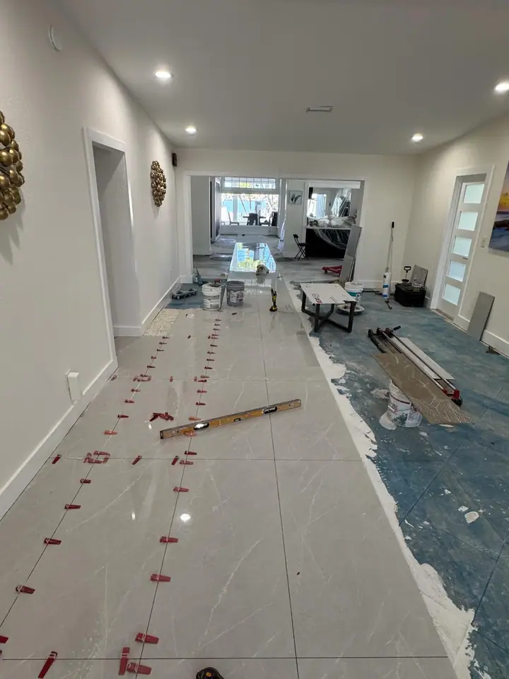 High-gloss large-format marble-look porcelain floors in a living space