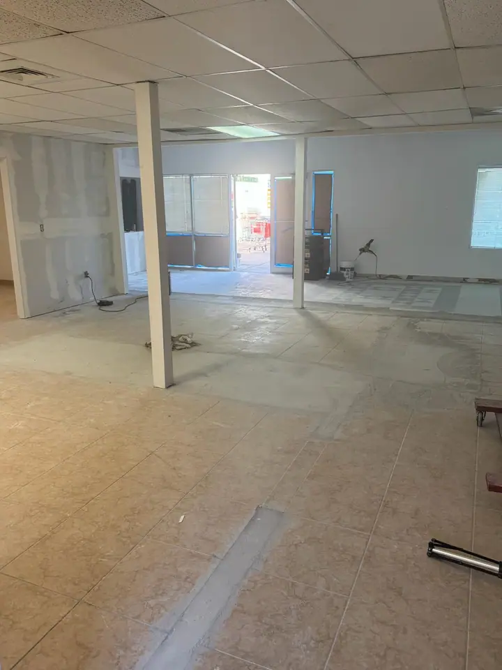 Commercial interior with large-format tile and a decorative floor inlay