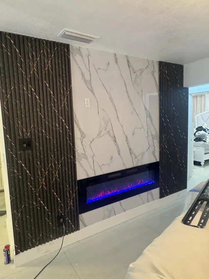 Custom fireplace wall with marble porcelain slab and fluted side panels
